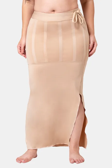 Dermawear Shapewear on X: Traditional petticoats are puffy, thus making  you look larger in a saree. On the other hand, saree shapewear is designed  to fit you perfectly and contour your sides