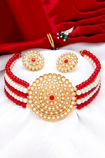 white and red necklace