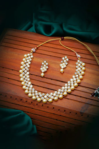 Sukkhi Glimmery Pearl Gold Plated Kundan Choker Necklace Set For Women