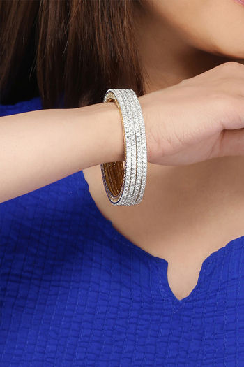 Yellow Chimes Set of 4 PCs White AD Studded Gold Toned Handcrafted Classic Bangles